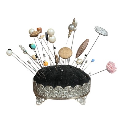 Lot 2581 - Large silver plated pin cushion and collection of hat pins