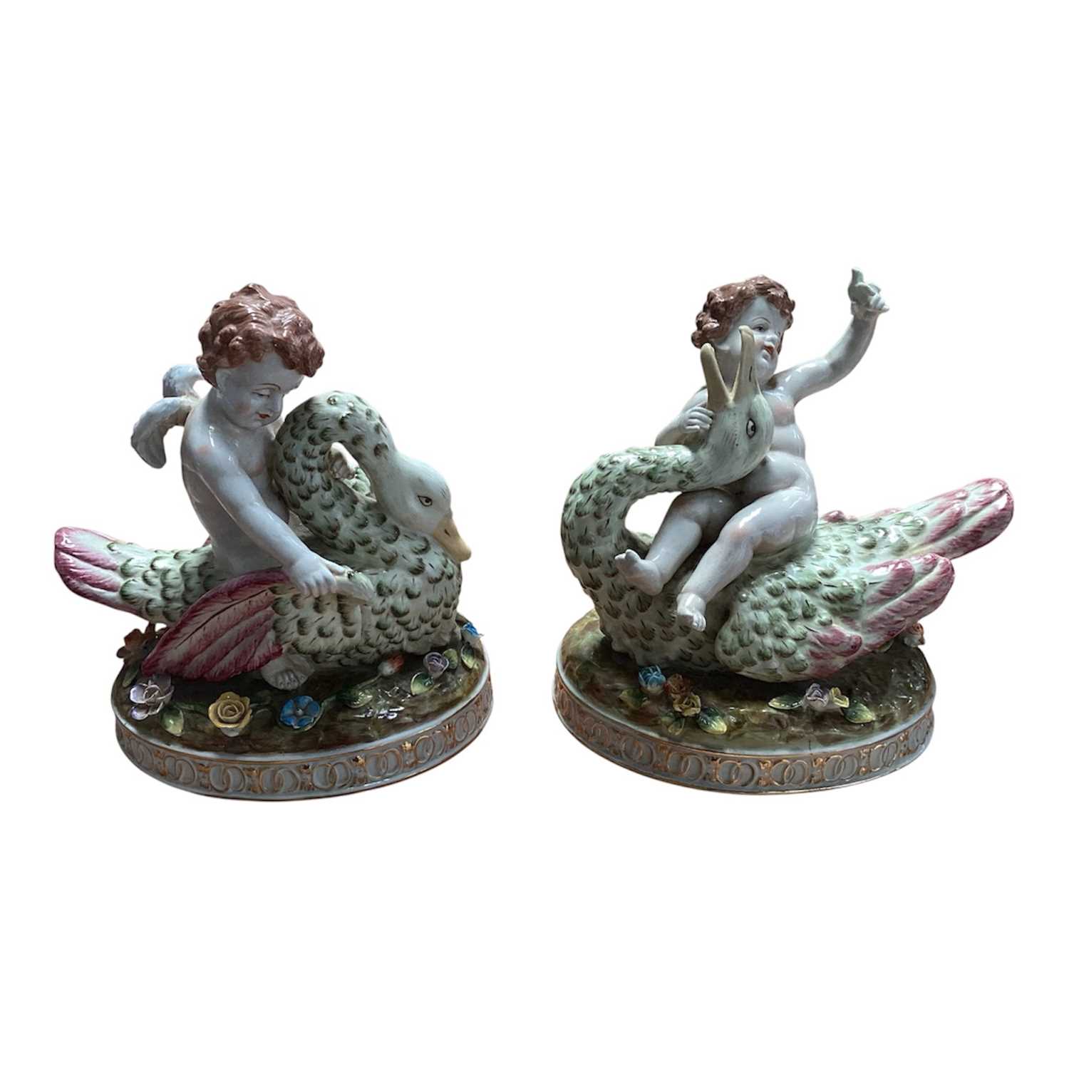 Lot 5045 - Pair of early 20th century Dresden porcelain ornaments of angels on swans