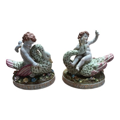 Lot 5045 - Pair of early 20th century Dresden porcelain ornaments of angels on swans