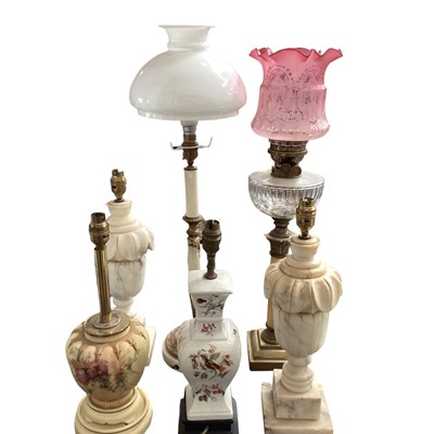 Lot 175 - Pair of marble lamps together with a Victorian oil lamp with a cranberry etched shade, and other lamps