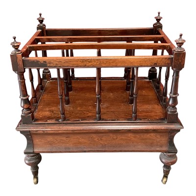Lot 1413 - Early Victorian rosewood Canterbury, with spindle divides and flush drawer to the concave frieze on turned legs and castors, 55cm wide
