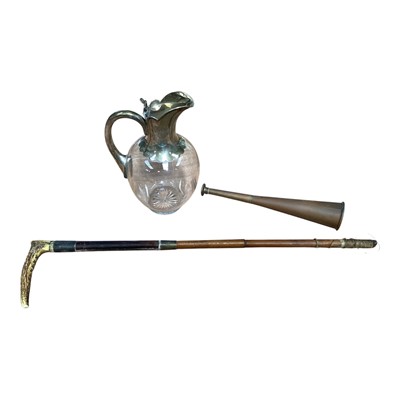 Lot 5147 - Silver mounted glass water jug, together with a silver mounted hunting crop and copper horn (3)