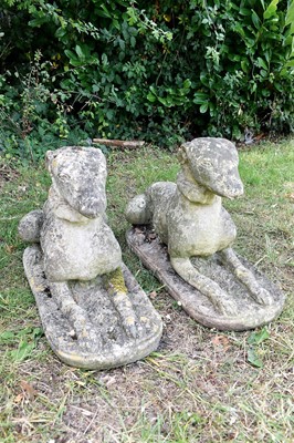Lot 1436 - Pair of reconstituted stone models of greyhounds