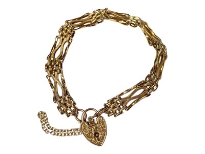 Lot 108 - 9ct gold gate bracelet with an engraved padlock clasp and safety chain