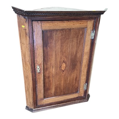 Lot 5389 - Georgian oak hanging corner cupboard with dentil cornice.