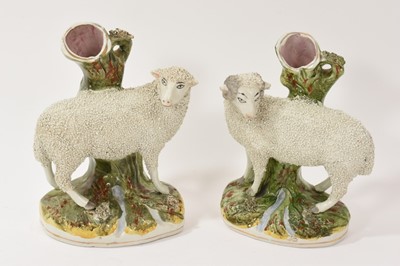 Lot 95 - Pair of Staffordshire sheep spill vases