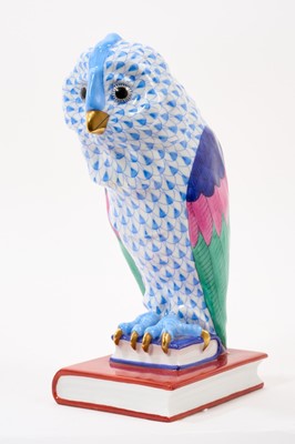 Lot 2 - Herend porcelain model of an owl, painted on a blue ground, shown seated on books, marks to base, 21cm high