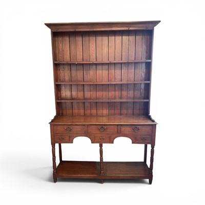 Lot 1319 - George III and later oak high dresser, with boarded rack, the base having six drawers to the shaped frieze, raised on turned supports with pot board below, 140cm wide x 42cm deep x 215cm high