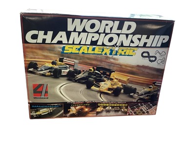 Lot 1801 - Scalextric World Championship 4 lane slot car set with 4 Formula 1 Racing Cars & hand controls and accessories, boxed C888 (1)