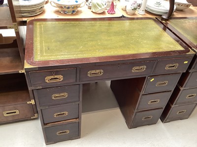 Lot 5301 - Georgian style twin pedestal desk with inset leather lined top, military style flush brass handles and nine drawers below, 98cm wide, 53.5cm deep, 76.5cm high