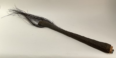 Lot 922 - Late 19th / early 20th century Elephants tail, with brass ring for hanging, approximately 115cm long