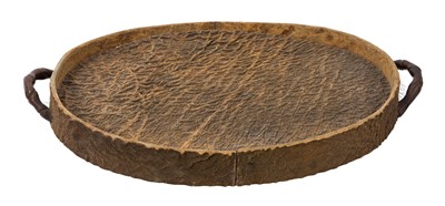 Lot 920 - Unusual early 20th century Rowland Ward Elephant hide tray of oval form with twin handles and wooden base with applied plaque 'Rowland Ward Ltd. "The Jungle" 166 Piccadilly, W', 50cm long x 33.5...