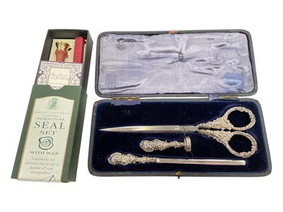 Lot 137 - Victorian silver mounted desk set to include a pair of scissors, seal and letter opener, in fitted case, together with a contemporary wax seal set