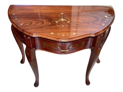 Lot 5325 - Hardwood demi lune hall table with brass inlaid decoration and single drawer, 91cm wide, 46.5cm deep, 74cm high, together with a similar folding tray top table (2)