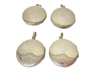 Lot 63 - Four contemporary silver and enamel circular lockets depicting a jockey, cavalry soldier, golfer and ducks
