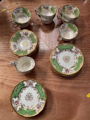 Lot 5230 - Coalport tea set, decorated with flowers on a green and gilt ground, comprising 7 cups, 4 saucers, 8 side plates and a cream jug