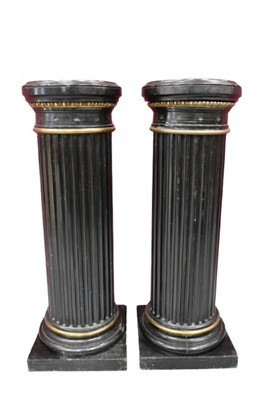 Lot 1329 - Pair of antique ebonised and gilt heightened pedestals, each of fluted form on square plinth, 118cm high