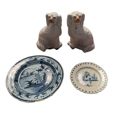 Lot 5097 - Pair of Victorian Staffordshire spaniels, an 18th century delftware dish and a pearlware plate painted both painted in blue in the Chinese style (4)