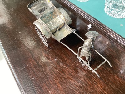 Lot 5094 - Group of silver and white metal, including a Chinese rickshaw and figures, sterling silver candle stick etc