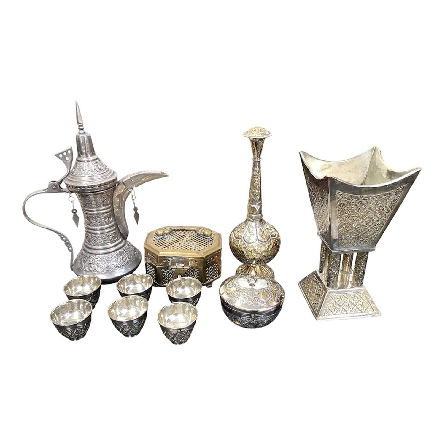 Lot 5095 - Group of Middle Eastern metalwares including a rose water sprinkler marked 'German silver', dallah etc
