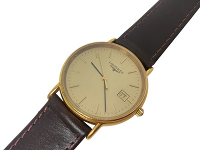 Lot 74 - Longines quartz wristwatch with circular gilt dial, baton markers and date aperture at 3 o'clock in a gold plated case with stainless steel back, 32mm diameter, on a replacement leather strap