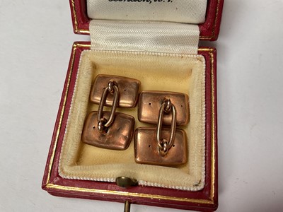 Lot 75 - Pair of Victorian rose gold cufflinks, the rectangular panels with engraved scroll decoration, in a red leather box