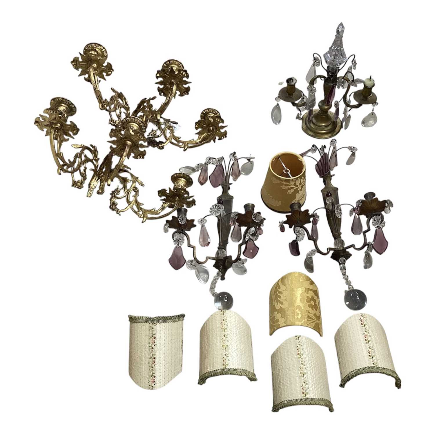 Lot 5103 - Group of brass lighting, including a pair of ormolu three branch wall lights, and other wall lights with prismatic drops, and some shades