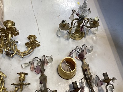 Lot 5103 - Group of brass lighting, including a pair of ormolu three branch wall lights, and other wall lights with prismatic drops, and some shades