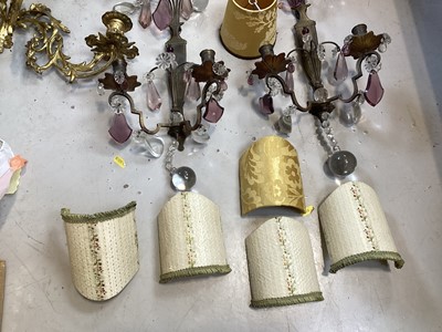Lot 5103 - Group of brass lighting, including a pair of ormolu three branch wall lights, and other wall lights with prismatic drops, and some shades