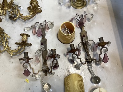 Lot 5103 - Group of brass lighting, including a pair of ormolu three branch wall lights, and other wall lights with prismatic drops, and some shades