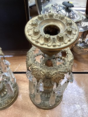 Lot 5104 - Pair of 19th century gilt brass candlesticks with foliate decoration, thistle stems and prismatic cut glass drops, 22.5cm high