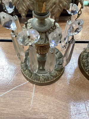 Lot 5104 - Pair of 19th century gilt brass candlesticks with foliate decoration, thistle stems and prismatic cut glass drops, 22.5cm high