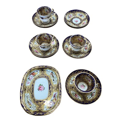 Lot 5105 - 19th century Copeland & Garrett porcelain tea set, comprising 8 saucers, 4 cups and one stand, polychrome painted with flowers and birds on a cobalt blue, pale yellow and gilt ground, some p...