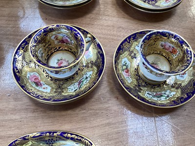 Lot 5105 - 19th century Copeland & Garrett porcelain tea set, comprising 8 saucers, 4 cups and one stand, polychrome painted with flowers and birds on a cobalt blue, pale yellow and gilt ground, some p...