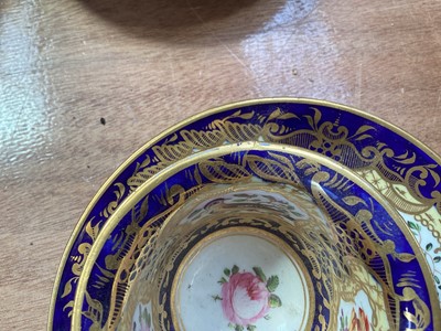 Lot 5105 - 19th century Copeland & Garrett porcelain tea set, comprising 8 saucers, 4 cups and one stand, polychrome painted with flowers and birds on a cobalt blue, pale yellow and gilt ground, some p...