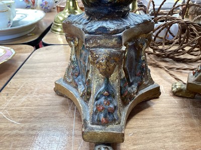 Lot 5107 - Three Italian giltwood and gesso candlesticks, converted to lamps, the central columns supported by shells, on triangular bases with crests, the bases on paw feet, 27.5cm high excluding light fi...