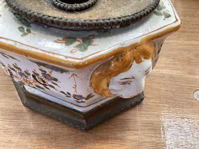 Lot 5108 - 19th century faience inkstand, with lion mask handles, polychrome painted with floral swags, with brass fittings to the top, marked to base, 21cm across