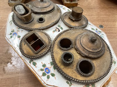 Lot 5108 - 19th century faience inkstand, with lion mask handles, polychrome painted with floral swags, with brass fittings to the top, marked to base, 21cm across