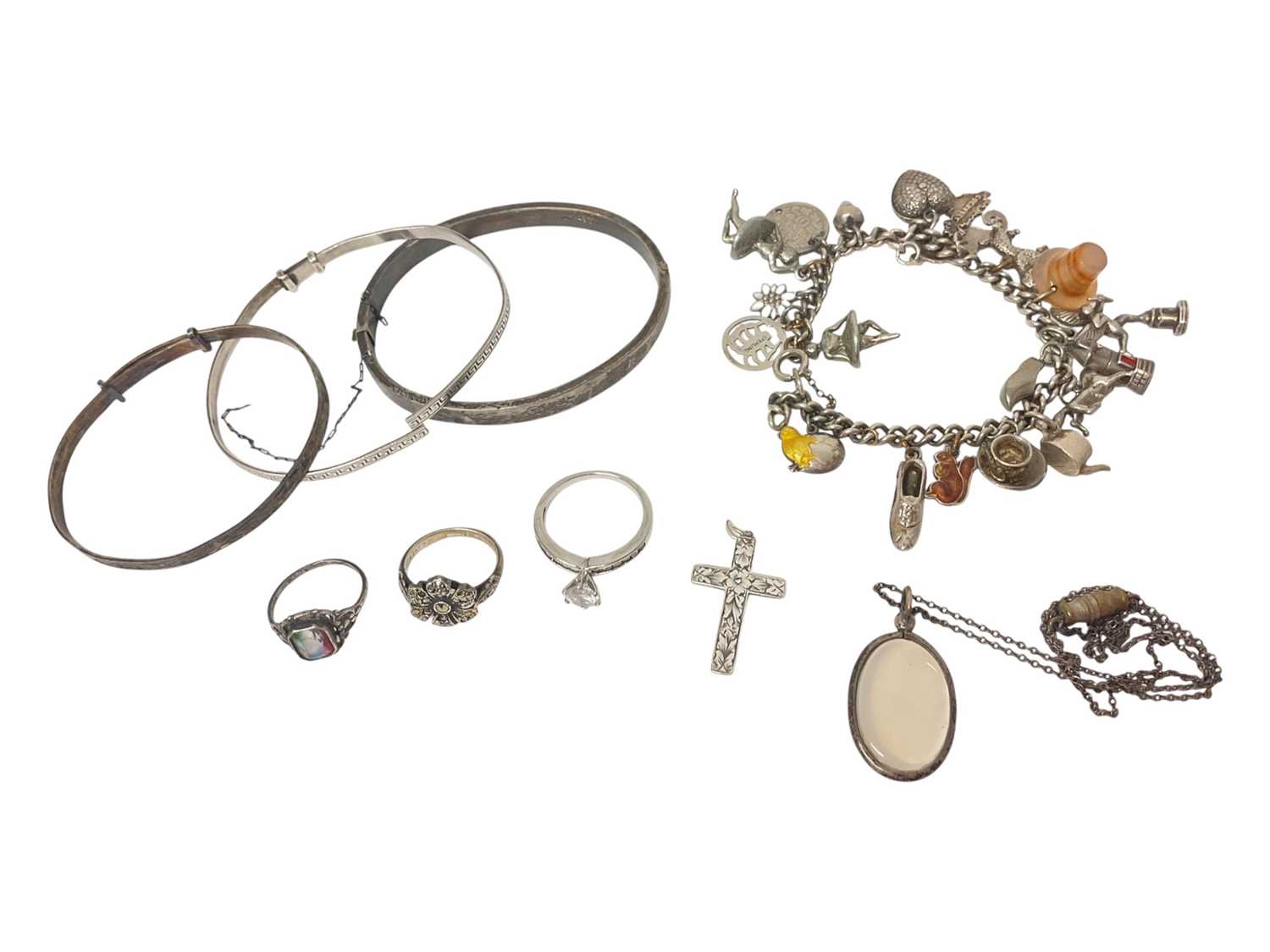 Lot 90 - Silver charm bracelet, silver bangles, silver rings etc