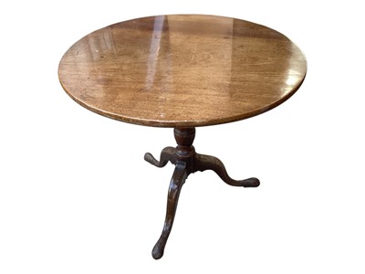 Lot 5356 - Georgian mahogany wine table with circular tilt top on turned column and three hipped splayed legs, 65cm diameter, 68.5cm high