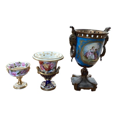 Lot 5111 - Sèvres style ormolu mounted porcelain vase, painted with panels containing figures and flowers, on a bleu celeste ground, with ram's heads and wreath handles, together with two smaller 19th cent...