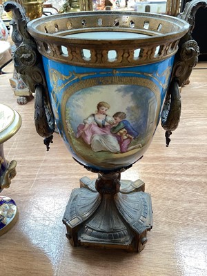 Lot 5111 - Sèvres style ormolu mounted porcelain vase, painted with panels containing figures and flowers, on a bleu celeste ground, with ram's heads and wreath handles, together with two smaller 19th cent...