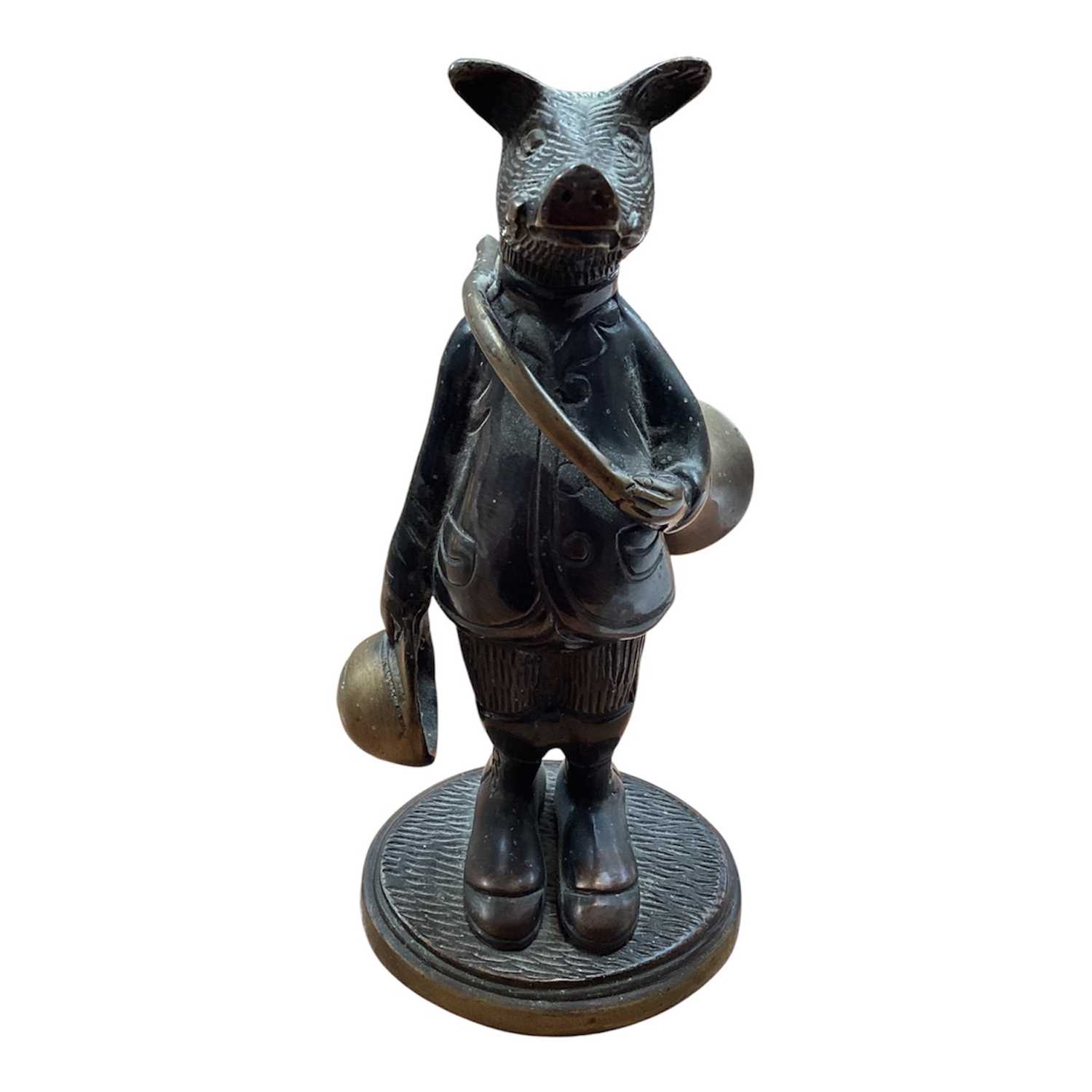 Lot 5114 - Bronze figure of an anthropomorphic boar, modelled with a French horn and a hat, on an oval base, 19cm high
