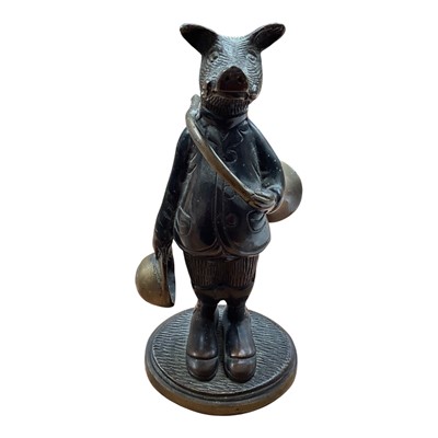 Lot 5114 - Bronze figure of an anthropomorphic boar, modelled with a French horn and a hat, on an oval base, 19cm high