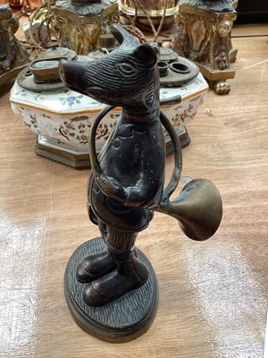 Lot 5114 - Bronze figure of an anthropomorphic boar, modelled with a French horn and a hat, on an oval base, 19cm high