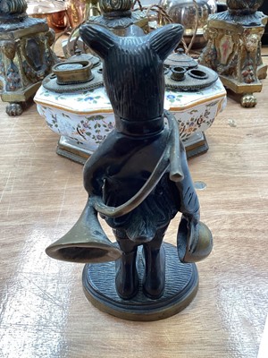 Lot 5114 - Bronze figure of an anthropomorphic boar, modelled with a French horn and a hat, on an oval base, 19cm high