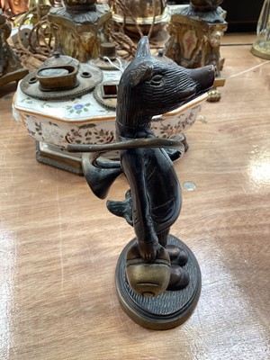Lot 5114 - Bronze figure of an anthropomorphic boar, modelled with a French horn and a hat, on an oval base, 19cm high