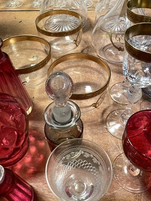Lot 5120 - Group of mostly antique glassware, including a Bohemian flash cut glass bottle and stopper, pair of three ring decanters, continental gilt glass jug and finger bowls, cranberry glass, etc