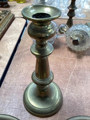 Lot 5117 - Pair of brass ejector candlesticks, one with mark for H. Loveridge & Co, Wolverhampton, and another brass candlestick (3)