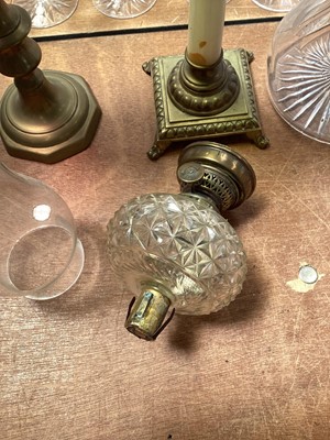 Lot 5119 - Three antique oil lamps with coloured glass shades, two of the burners by Gaudard France, and the other Kosmos, each approx 40cm high excluding chimneys, together with other oil lamp parts